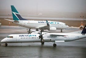 A WestJet De Havilland Q400 turboprop airplane, foreground, makes its way past a Boeing 737 on the tarmac of the Halifax Stanfield International Airport. WestJet plans to relocate its fleet of the 78-passenger planes to Western Canada. The plane is presently used on the carrier’s Sydney to/from Halifax flight. SALTWIRE FILE PHOTO