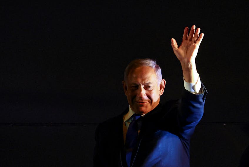 FILE PHOTO: Former Prime Minister Benjamin Netanyahu waves to a rally held by right-wing Israelis in Jerusalem, April 6, 2022. REUTERS/Ronen Zvulun  Former Israeli Prime Minister Benjamin Netanyahu waves to a rally held by right-wing Israelis in Jerusalem on April 6. Although he is still in the midst of a trial on corruption charges, Netanyahu has not ruled out an attempt to return to power in the next election. REUTERS file photo/Ronen Zvulun