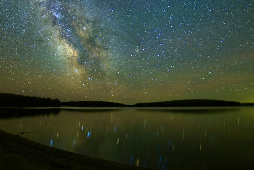 The Milky Way shimmers above the waters of Kejimkujik Lake. - Dave Chapman