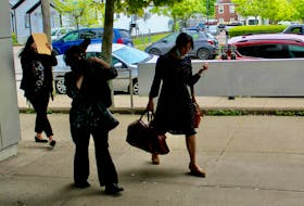 Georgette Young, from left, Lydia Saker, and Angela Macdonald attend Nova Scotia Supreme Court in Sydney on Thursday for the continuation of their sentencing hearing, along with family member Nadia Saker (not shown). The family was found guilty in February of 10 fraud charges and 10 counts of filing false GST claims with the Canada Revenue Agency. Another 10 offences were stayed. CAPE BRETON POST PHOTO