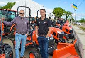 Keltic Kubota owner/president Steve van Nostrand, left, and his son, Daniel, display a lot full of tractors — but zero ride-on lawn mowers in stock at their Dodd Street lot. IAN NATHANSON/CAPE BRETON POST