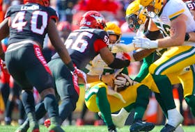 The Calgary Stampeders' Jameer Thurman received a roughing the passer call against quarterback Trevor Harris of the Edmonton Elks at McMahon Stadium on Monday, Sept. 6, 2021.