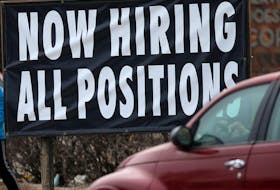 Signs like this one in Winnipeg in April are becoming more common as job vacancies in Canada soar. 