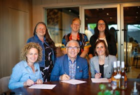 Members of the Glooscap Nation and Benjamin Bridge signing an agreement to produce a collaboration wine. Back row: Councillor Gail Tupper, Councillor Charlotte Warrington, Councillor Amanda Francis Front row: Devon McConnell-Gordon, Chief Sidney Peters, Ashley McConnell-Gordon