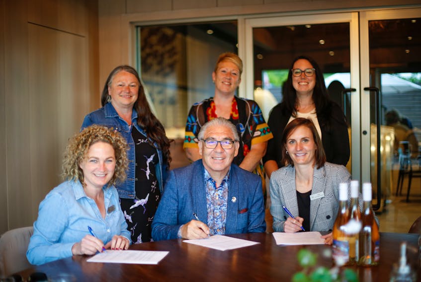 Members of the Glooscap Nation and Benjamin Bridge signing an agreement to produce a collaboration wine. Back row: Councillor Gail Tupper, Councillor Charlotte Warrington, Councillor Amanda Francis Front row: Devon McConnell-Gordon, Chief Sidney Peters, Ashley McConnell-Gordon