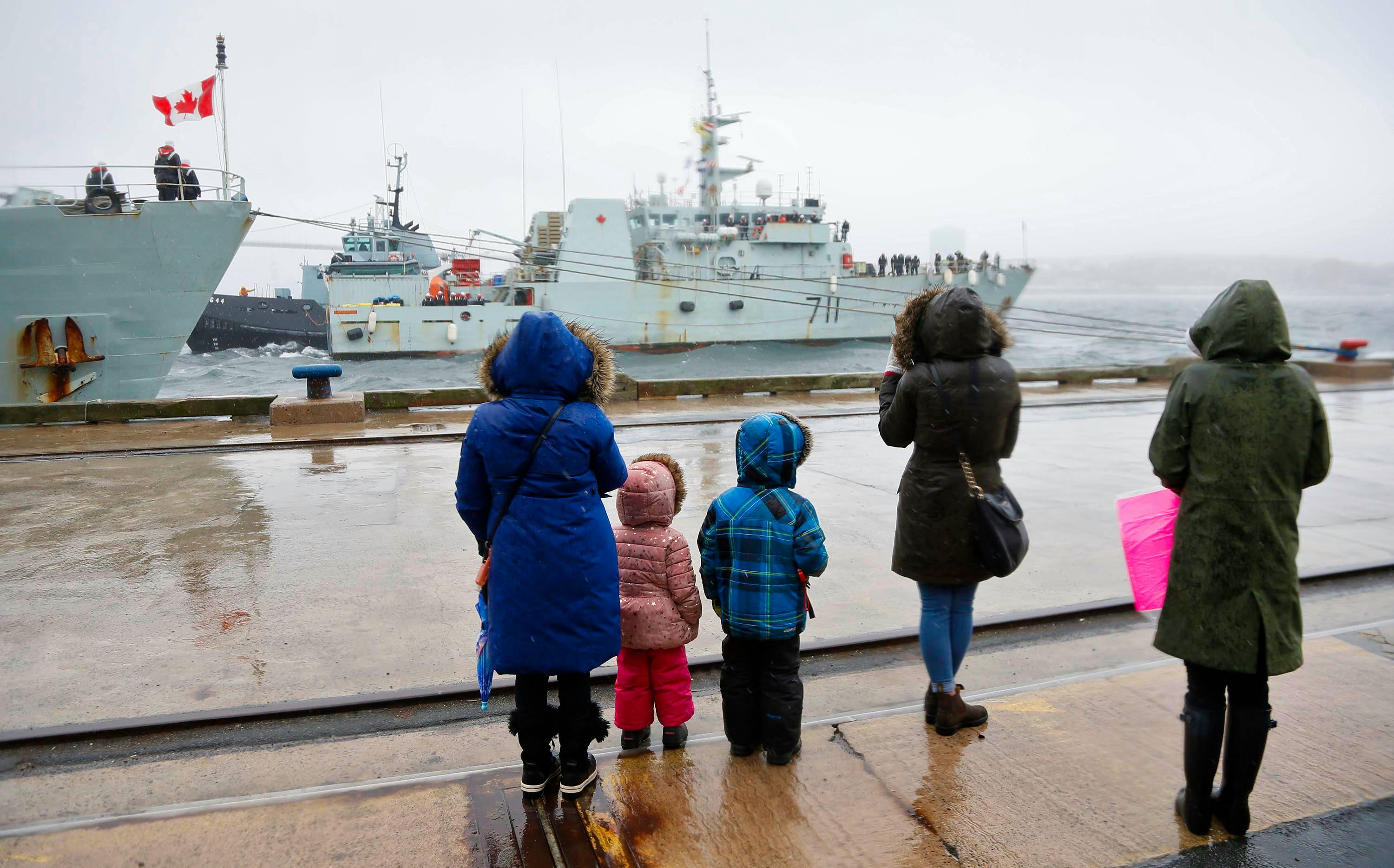 Family members look on as HMCS Summerside is pushed towards a jetty, following it’s arrival at HMC Dockyard in Halifax Tuesday April 17, 2018. Along with HMCS Kingston, the 2 returned to Halifax after a 3-month deployment to West Africa. 

Tim Krochak/The Chronicle Herald