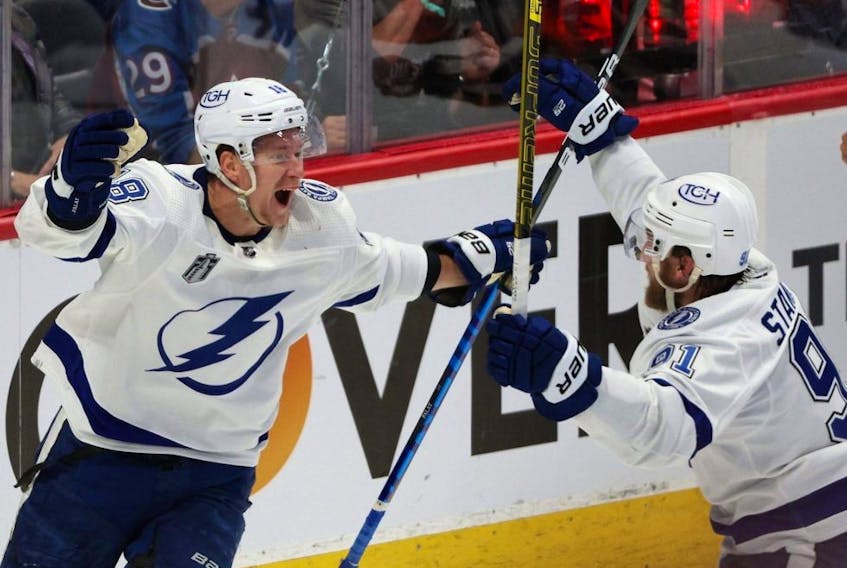 Lightning forward Ondrej Palat, left, celebrates a goal with teammate Steven Stamkos during the third period in Game 5 of the NHL Stanley Cup Final against the Avalanche at Ball Arena in Denver, Friday, June 24, 2022.