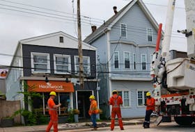 Nova Scotia Power work crews were on the scene of a collision between a skidding car and a power pole on Saturday morning. - Shawn Duggan