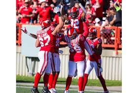 The Calgary Stampeders celebrate receiver Malik Henry's second half touchdown against the Edmonton Elks at McMahon Stadium in Calgary on Saturday, June 25, 2022. The Stampeders won 30-23.
