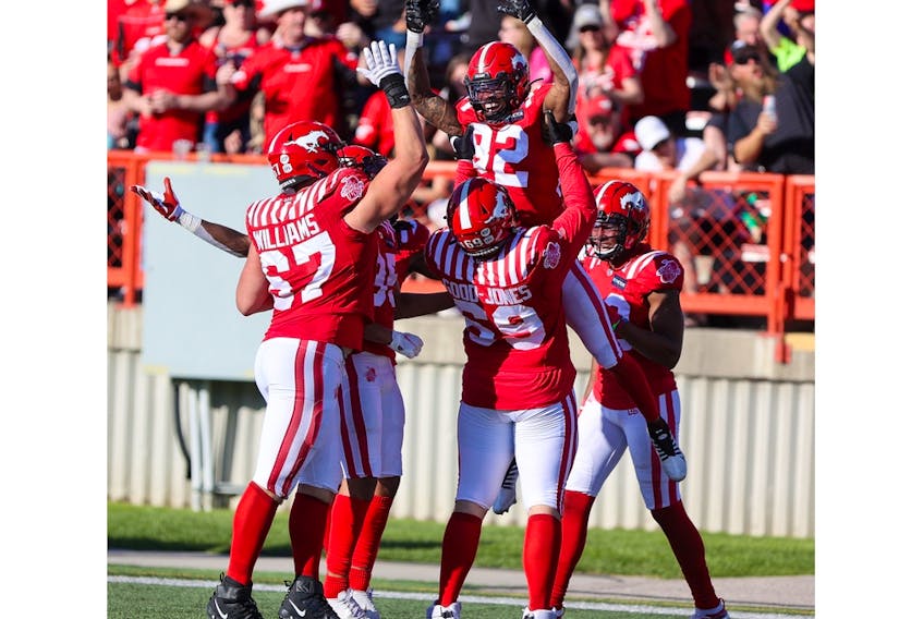 The Calgary Stampeders celebrate receiver Malik Henry's second half touchdown against the Edmonton Elks at McMahon Stadium in Calgary on Saturday, June 25, 2022. The Stampeders won 30-23.
