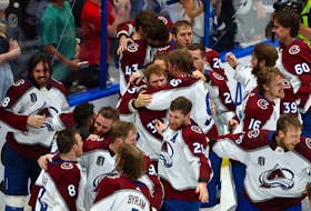 Alex Newhook, Number 18 (left) and other members of the Colorado Avalanche react after defeating the Tampa Bay Lightning in Game 6 of the 2022 Stanley Cup Final at Amalie Arena Sunday night. Mark J. Rebilas-USA TODAY Sports
