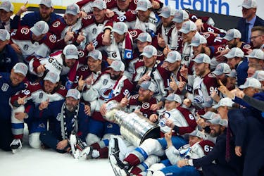 The Colorado Avalanche pose for a photo after defeating the Tampa Bay Lightning to win the Stanley Cup in game six of the 2022 Stanley Cup Final at Amalie Arena. - Mark J. Rebilas-USA TODAY Sports