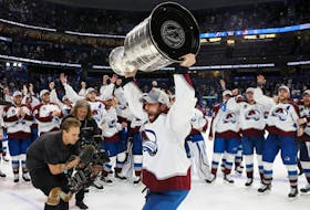 Andrew Cogliano of the Colorado Avalanche hoists the Stanley Cup after his team defeated the Tampa Bay Lightning 2-1 in Game 6 to win the Stanley Cup on Sunday night in Tampa, Fla.
