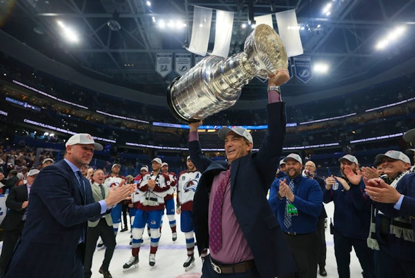 Colorado Avalanche GM Joe Sakic hoists the Stanley Cup after his team beat the Tampa Bay Lightning 2-1 in Game 6 of their series on June 26, 2022 in Tampa, Fla.