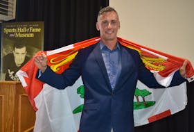 New Haven native Jared Connaughton shows off his provincial pride after being inducted into the P.E.I. Sports Hall of Fame on June 28 in Charlottetown. Dave Stewart • The Guardian