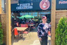 Fired Creations owner and manager Alisha Barron squints into the bright sunshine while a couple of customers of the pottery painting café wave from their seats on the Sydney establishment’s new patio. DAVID JALA/CAPE BRETON