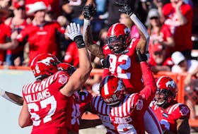 The Stampeders celebrate receiver Malik Henry's second-half touchdown against the Edmonton Elks at McMahon Stadium in Calgary on Saturday.