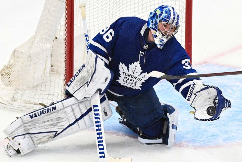 Toronto Maple Leafs goalie Jack Campbell (36) makes a glove save against the Tampa Bay Lightning in game seven of the first round of the 2022 Stanley Cup Playoffs at Scotiabank Arena. 