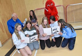 A new keepsake booklet was unveiled at École Wedgeport in Yarmouth County on June 21. Blair Boudreau (pictured left) approached the school with an idea of a historical booklet years ago. Pictured here with him are students Lacey Pothier, Lauren LeBlanc, Lindsay Bowering, Mia LeBlanc, Gracie Corporong, along with school principal Angèle Marr and the school’s mascot. TINA COMEAU PHOTO