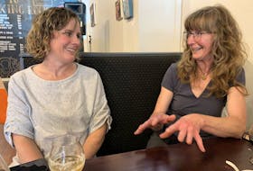 Emily Tipton (left), co-founder of the Boxing Rock Brewing Company and muti-faceted artist Kim Smerek talk art and community while sharing a brew at the company’s taproom. A solo exhibit of Smerek’s work will be on display in the taproom until August. KATHY JOHNSON