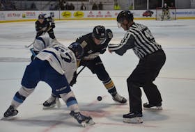 Owen Saye, 17, of the Charlottetown Islanders takes a faceoff against the Sherbrooke Phoenix’s Anthony Munroe-Boucher, 27, during a Quebec Major Junior Hockey League playoff game at Eastlink Centre recently. Saye will face his former team when the Islanders and Shawnigan Cataractes open the best-of-seven President Cup final series in Charlottetown on June 4. Jason Simmonds • The Guardian