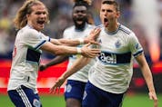  Vancouver Whitecaps’ Ranko Veselinovic, right, and Florian Jungwirth celebrate Veselinovic’s goal against Real Salt Lake during the first half of an MLS soccer game in Vancouver, on Saturday, June 4, 2022.