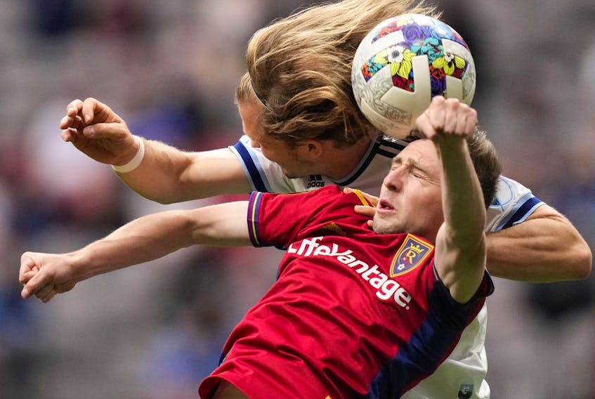  Real Salt Lake’s Andrew Brody, front right, and Vancouver Whitecaps’ Florian Jungwirth vie for the ball during the first half of an MLS soccer game in Vancouver, on Saturday, June 4, 2022.