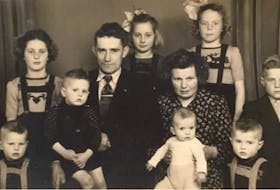 The Van Berkel family after arriving in Nova Scotia in 1951. To keep all of the eight children safe during their journey across the Atlantic, the children were tied together with rope. The family settled in Antigonish. - Contributed