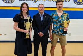 Kinkora Regional High School athletic director Trent Ranahan, centre, congratulates the 2021-22 athletes of the year, Lydia Hamill, left, and Makenzie Cutcliffe, right. KRHS held its annual awards ceremony recently. Contributed