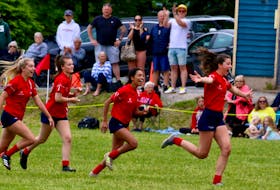 As the whistle blew at the conclusion of the 2022 SSNS Division 1 Rugby Championship, Ava Shearer (front) and teammates Josie King, Cela MacDougall and Carolina Herrera celebrate.