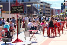 People enjoy the pedestrian mall on a sunny day in downtown St. John's. — SaltWire Network file photo