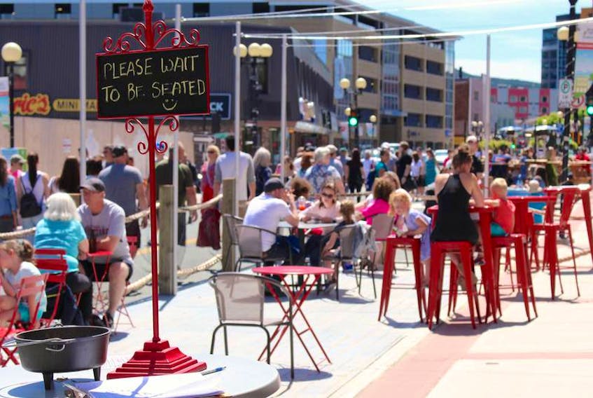 People enjoy the pedestrian mall on a sunny day in downtown St. John's. — SaltWire Network file photo