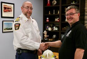 Windsor Fire Chief Jamie Juteau, left, congratulated Jeff Pinch on becoming the first-ever deputy chief for the Southwest Hants fire substation in Vaughan.