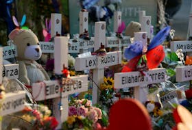 FILE PHOTO: Flowers, toys, and other objects to remember the victims of the deadliest U.S. school mass shooting resulting in the death of 19 children and two teachers, are seen at a memorial at Robb Elementary School in Uvalde, Texas, U.S. May 30, 2022. REUTERS/Veronica G. Cardenas/File Photo  A memorial for victims of the Uvalde, Tex. school shooting. — Reuters file photo