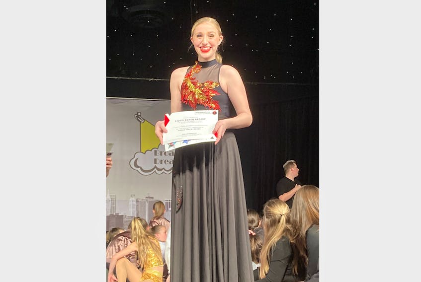 Lyla LaSaga, of Stephenville, with the $1,000 scholarship she received at the Wanna Dance competition in St. John's last month. The scholarship allows her to attend a Lightning Dance Intensive, the Walt Disney World Florida Spooktacular, in October. CONTRIBUTED