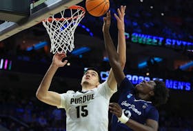 Zach Edey #15 of the Purdue Boilermakers and Clarence Rupert #12 of the St. Peter's Peacocks jump for the ball in the first half of the game in the Sweet Sixteen round of the 2022 NCAA Men's Basketball Tournament at Wells Fargo Center on March 25, 2022 in Philadelphia, Pennsylvania.