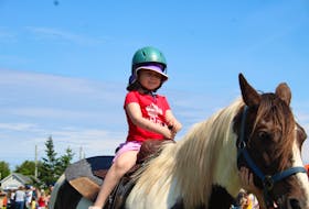Palmer Gallant enjoys a pony ride at Green Shore during the Canada Day festivities. - Kristin Gardiner