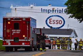 Members of the Cape Breton Regional Hazmat Team and Cape Breton Regional Fire Service firefighters prepare a plan after a major spill of 600,000 litres of gasoline was reported at the Imperial Oil storage facility in north end Sydney on Friday. JEREMY FRASER/CAPE BRETON POST