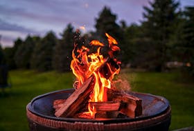 A backyard campfire is a fun social activity, but it also helps keeps bugs away. R.D. Smith photo/Unsplash