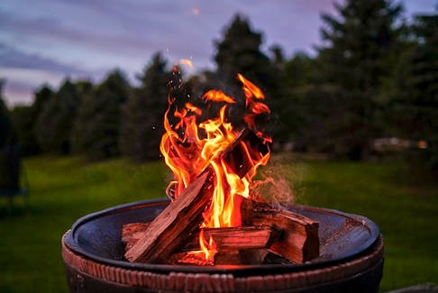 A backyard campfire is a fun social activity, but it also helps keeps bugs away. R.D. Smith photo/Unsplash