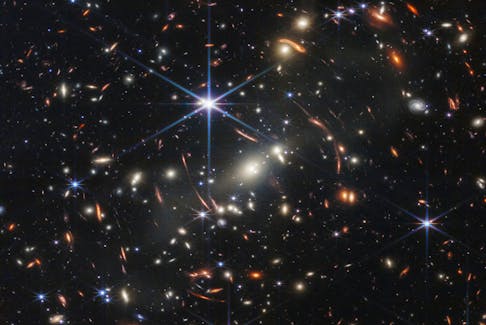The first full-colour image from NASA's James Webb Space Telescope, a revolutionary apparatus designed to peer through the cosmos to the dawn of the universe, shows the galaxy cluster SMACS 0723, known as Webb’s First Deep Field, in a composite made from images at different wavelengths taken with a Near-Infrared Camera and released Monday, July 11, 2022. - NASA, ESA, CSA, STScI, Webb ERO Production Team / Handout via Reuters
