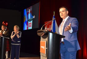 Yarmouth MLA Zach Churchill address the Liberal party faithful on Saturday, July 9, 2022, after it was announced at the Halifax Convention Centre that he won the party leadership vote. Leadership campaign co-chairs Dr. John Gillis and MLA Kelly Regan look on. - Francis Campbell photo