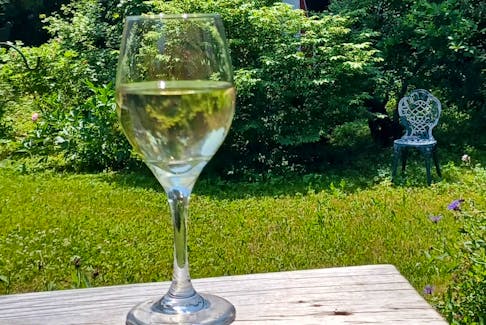 Who says working in the back can't mean working on a glass of wine? Contributed photo