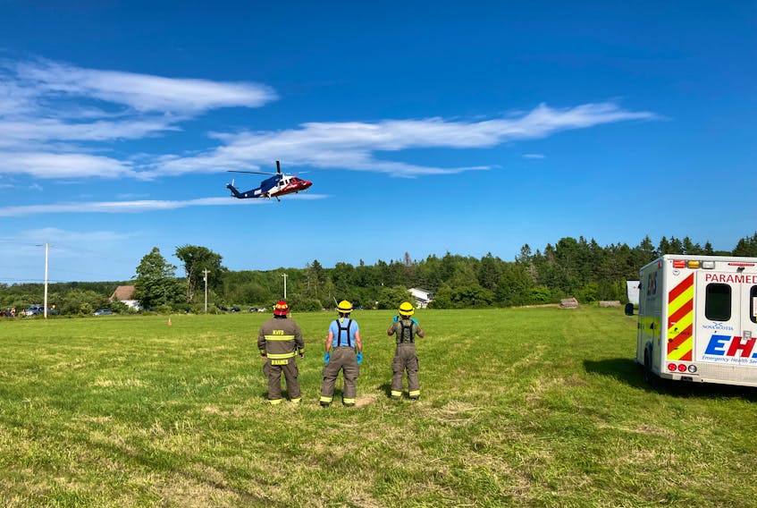 A LifeFlight helicopter prepares to land in a field in South Alton, Kings County to pick up a patient injured in a crash on Highway 12 Tuesday afternoon.