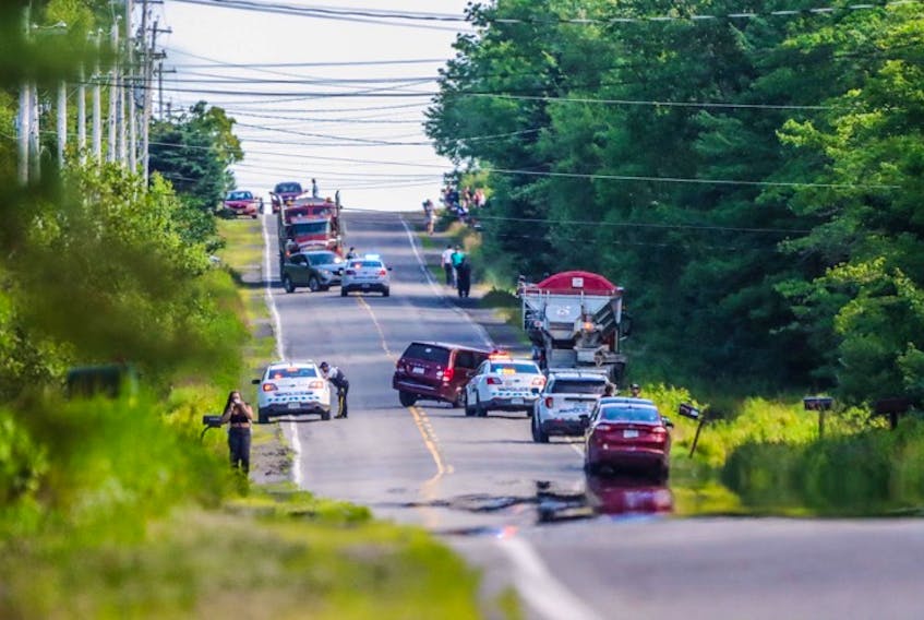 One person was killed and another suffered life-threatening injuries when a van collided with the back of gravel truck in Kings County Tuesday afternoon. - Adrian Johnstone