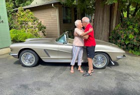 A birthday kiss from Linda Davidson who gave husband John his 1962 Corvette dream car on his 75th birthday. Alyn Edwards photo