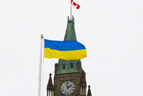 The Ukrainian flag is seen in front of the Peace Tower on Parliament Hill after Ukraine's President Volodymyr Zelenskiy addressed Canada's parliament in Ottawa, Ontario, Canada March 15, 2022.