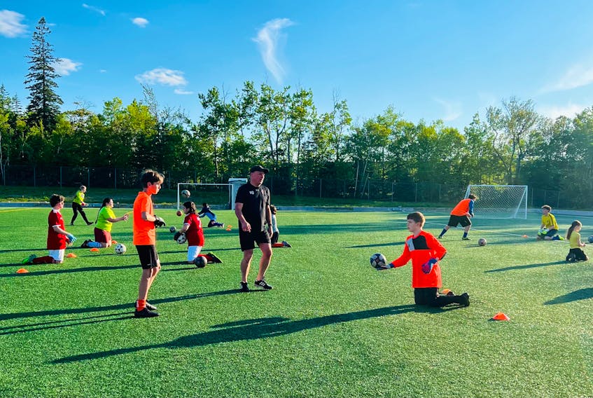 Cape Breton University Men’s Goalkeeper Coach Vernon O'Quinn, centre, puts some of the island’s young keepers through their paces at one of the free Soccer Cape Breton clinics that have been a huge success this summer. CONTRIBUTED