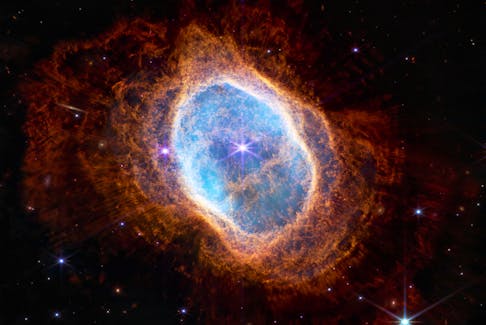 An observation of a planetary nebula from the NIRCam instrument of NASA's James Webb Space Telescope, a revolutionary apparatus designed to peer through the cosmos to the dawn of the universe and released July 12, 2022.    NASA, ESA, CSA, STScI, Webb ERO Production Team/Handout via REUTERS THIS IMAGE HAS BEEN SUPPLIED BY A THIRD PARTY.  This image of the Southern Ring, a planetary nebula — an expanding cloud of gas surrounding two dying stars around 2,000 light years away from Earth, will provide astronomers an opportunity to study stellar death in unprecedented detail. NASA, ESA, CSA, STScI, Webb ERO Production Team/Handout via REUTERS
