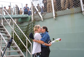 Isabelle Evans and Sailor First Class Melanie Farmer kiss after getting engaged following the return of HMCS Montreal to Halifax on Friday, July 15, 2022. The Montreal and HMCS Halifax both returned on Friday morning after the completion of a six-month deployment as part of NATO Operation Reassurance. Ryan Taplin - The Chronicle Herald